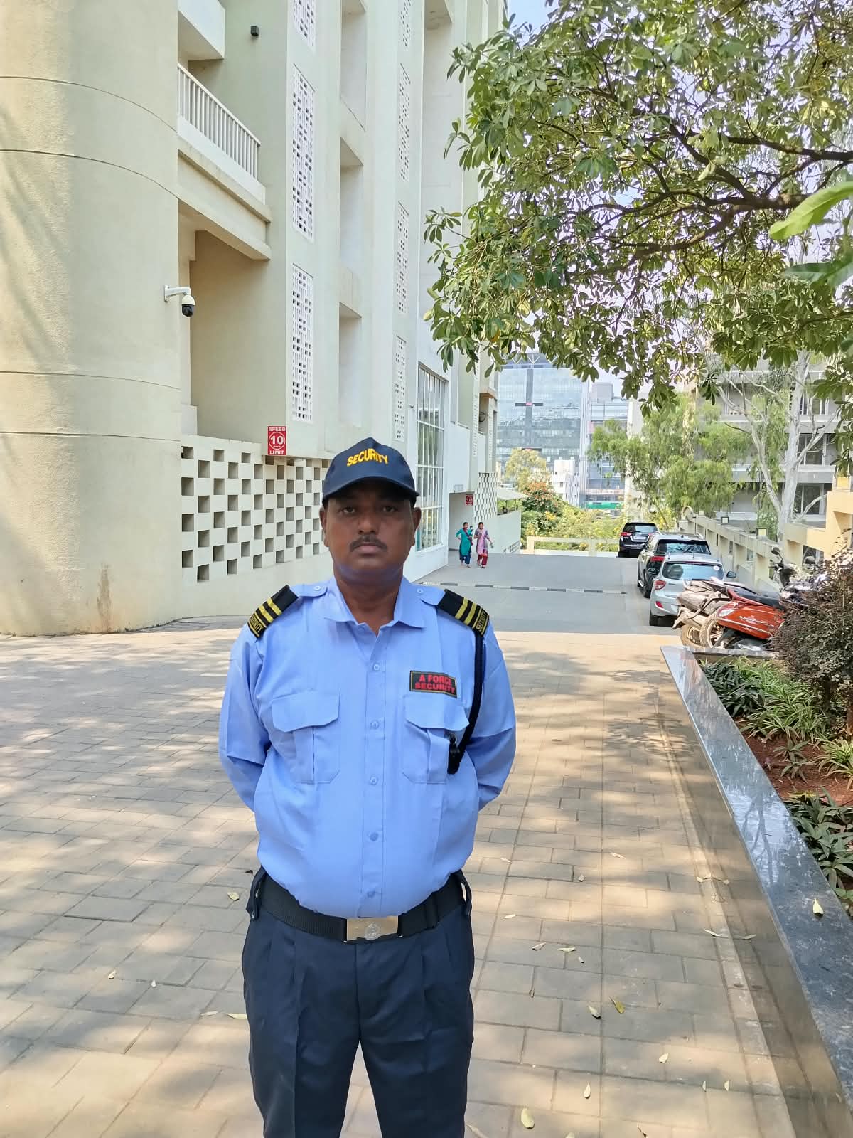 A Force Security guard standing outside campus building
